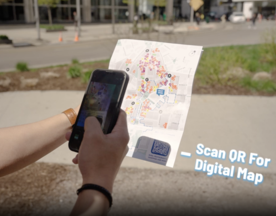 A visitor scanning a QR code to access an interactive digital map
